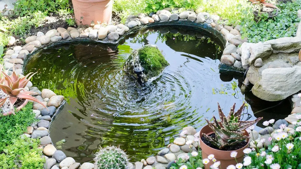 Garden pond in Norfolk by Hilton & Green Landscaping